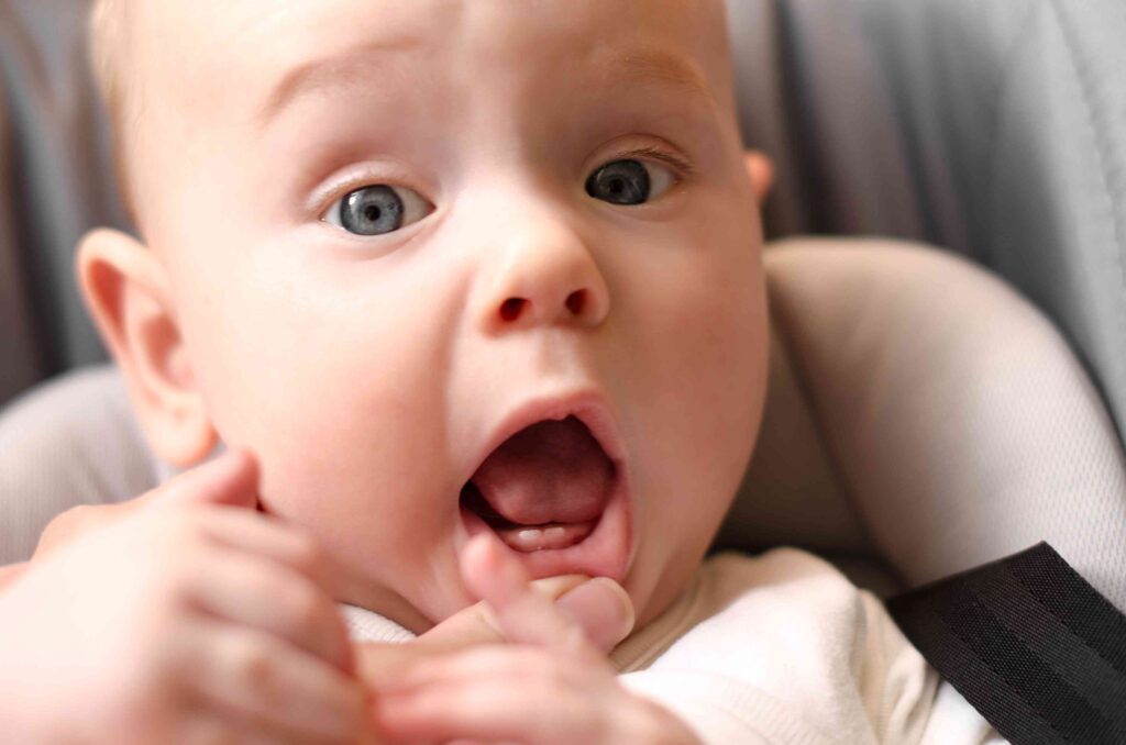 Baby showing his teeth